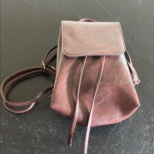 Small leather backpack/purse. Never used. New without tags